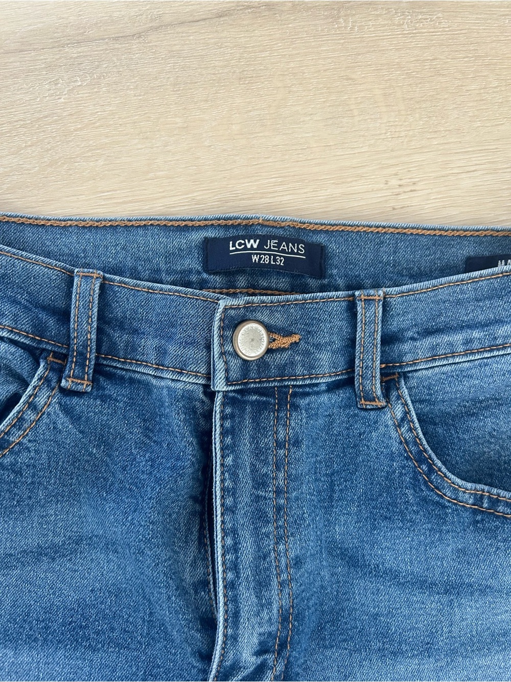High-Rise Flared Women's Jeans in Medium Blue - Picture 2 of 8